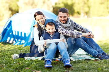 Image showing happy family with tablet pc and tent at camp site