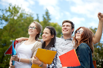 Image showing group of happy students showing triumph gesture