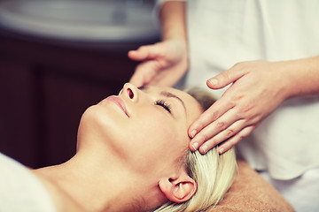 Image showing close up of woman having face massage in spa