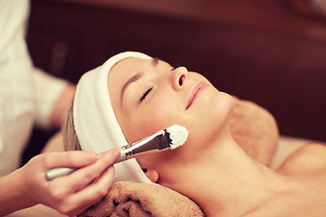 Image showing close up of young woman and cosmetologist in spa