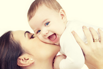 Image showing mother kissing her baby