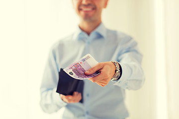 Image showing close up of businessman hands holding money