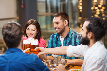 Image showing friends dining and drinking beer at restaurant