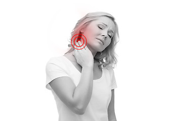 Image showing unhappy woman suffering from neck pain