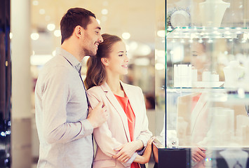 Image showing couple looking to shopping window at jewelry store