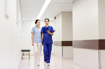 Image showing two medics or nurses at hospital with clipboard