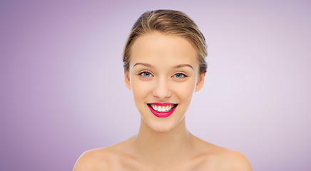 Image showing smiling young woman face and shoulders