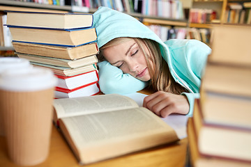 Image showing student or woman with books sleeping in library