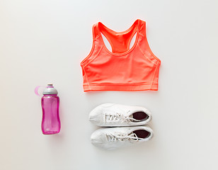 Image showing close up of female sports clothing and bottle set