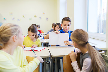 Image showing group of school kids writing test in classroom