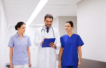 Image showing group of medics at hospital with clipboard