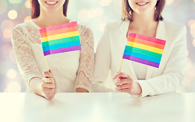 Image showing close up of happy lesbian couple with rainbow flag