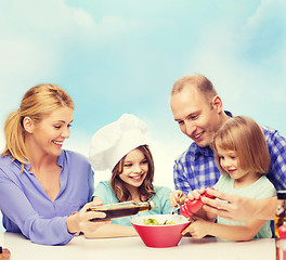 Image showing happy family with two kids eating at home