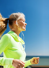 Image showing woman doing running outdoors