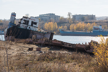 Image showing Partially dismantled boat on the river