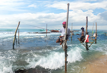 Image showing Fishermen on stick