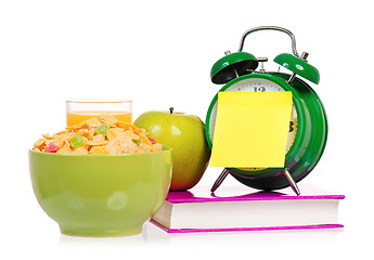 Image showing Big alarm clock with book and breakfast