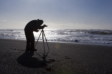 Image showing Photographer at black sand beach in Vik, Iceland