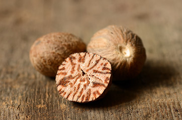 Image showing Nutmeg on wooden table