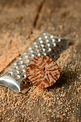 Image showing Nutmeg on wooden table