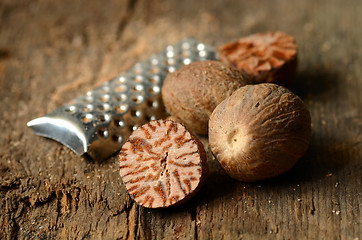 Image showing Nutmeg on wooden table