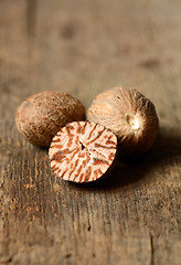 Image showing Nutmeg on wooden table