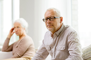 Image showing senior couple sitting on sofa at home