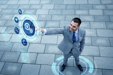 Image showing young smiling businessman outdoors from top