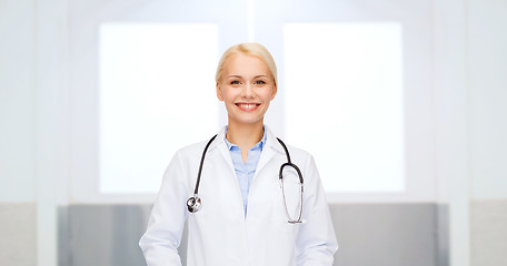 Image showing smiling female doctor in white coat