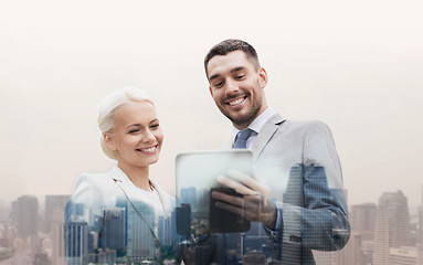 Image showing smiling businessmen with tablet pc in city