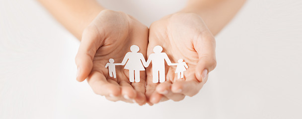 Image showing woman hands with paper man family