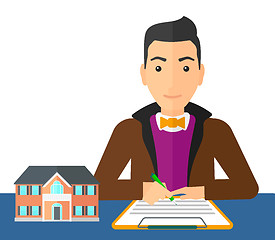 Image showing Real estate agent signing contract.