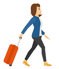 Image showing Woman walking with suitcase.