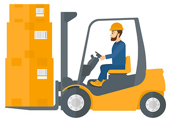 Image showing Worker moving load by forklift truck.