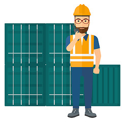 Image showing Stevedore standing on cargo containers background.