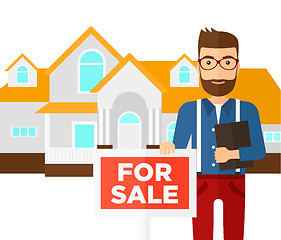 Image showing Real estate agent offering house.