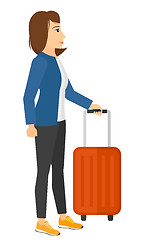 Image showing Woman standing with suitcase.