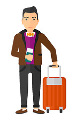 Image showing Man standing with suitcase and holding ticket.