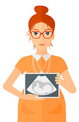 Image showing Pregnant woman with ultrasound image.