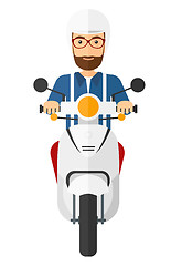 Image showing Man riding scooter.