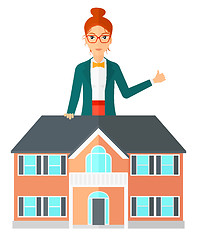 Image showing Real estate agent showing thumb up.