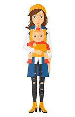 Image showing Woman holding baby in sling.