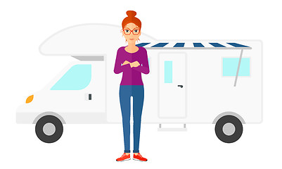 Image showing Woman standing in front of motor home.