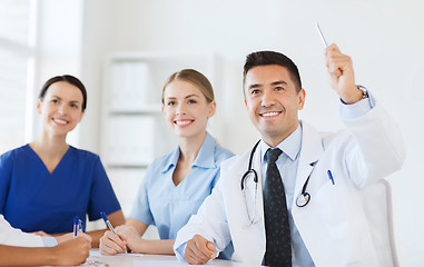 Image showing group of happy doctors on conference at hospital