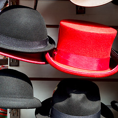 Image showing in london old red hat and black  the  fashion shop