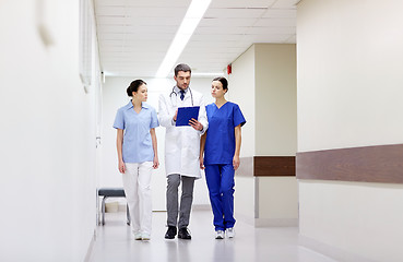 Image showing group of medics at hospital with clipboard