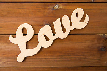 Image showing close up of word love cutout on wood