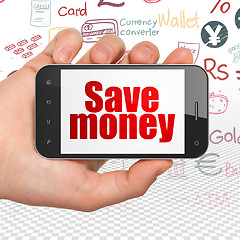 Image showing Money concept: Hand Holding Smartphone with Save Money on display