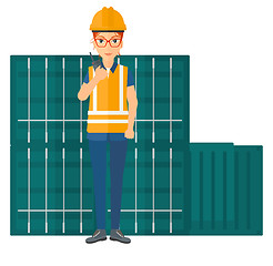 Image showing Stevedore standing on cargo containers background.