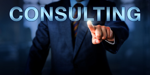 Image showing Management Consultant Pushing CONSULTING Onscreen